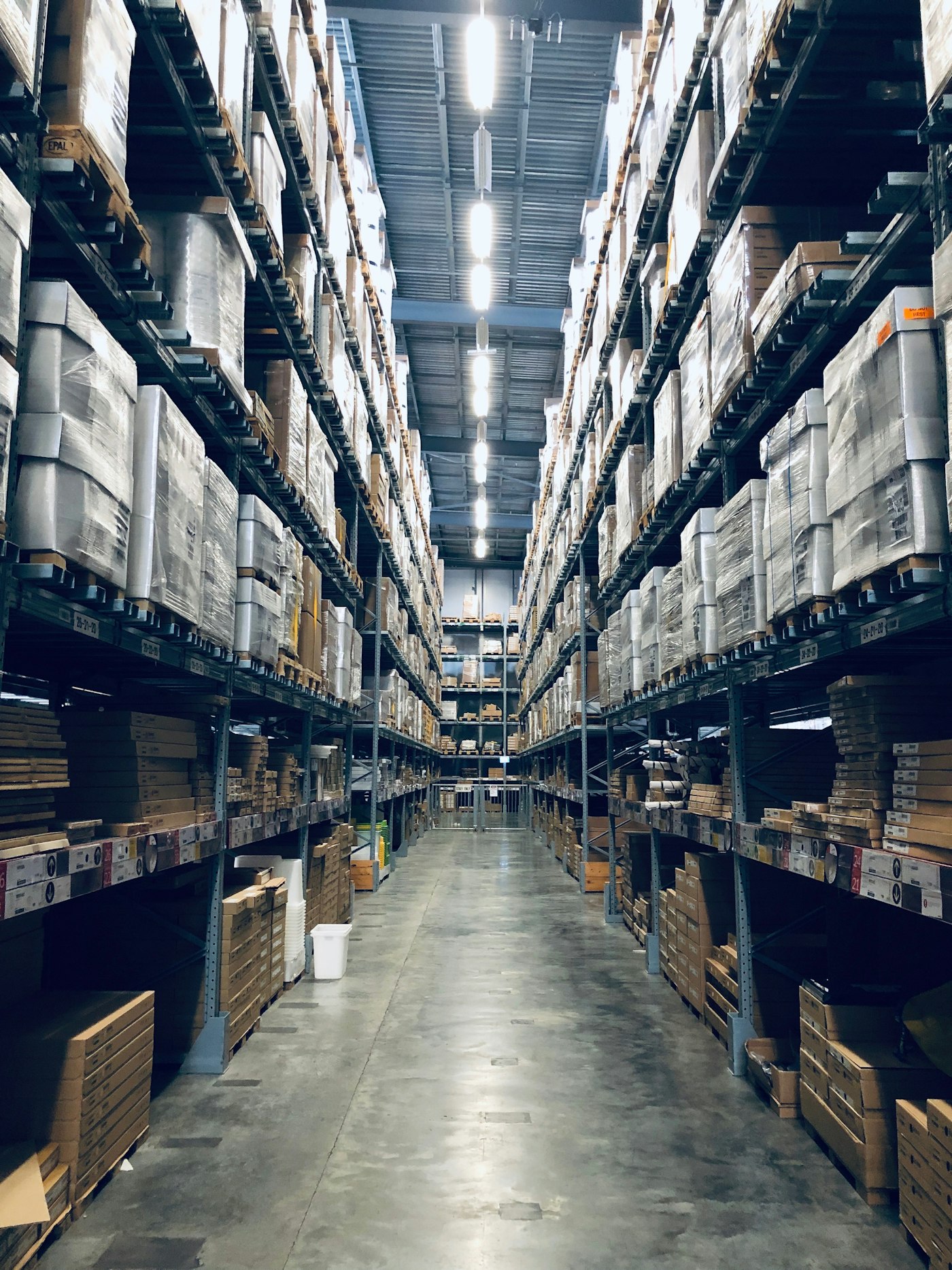 Long aisle of shelves inside a distribution warehouse