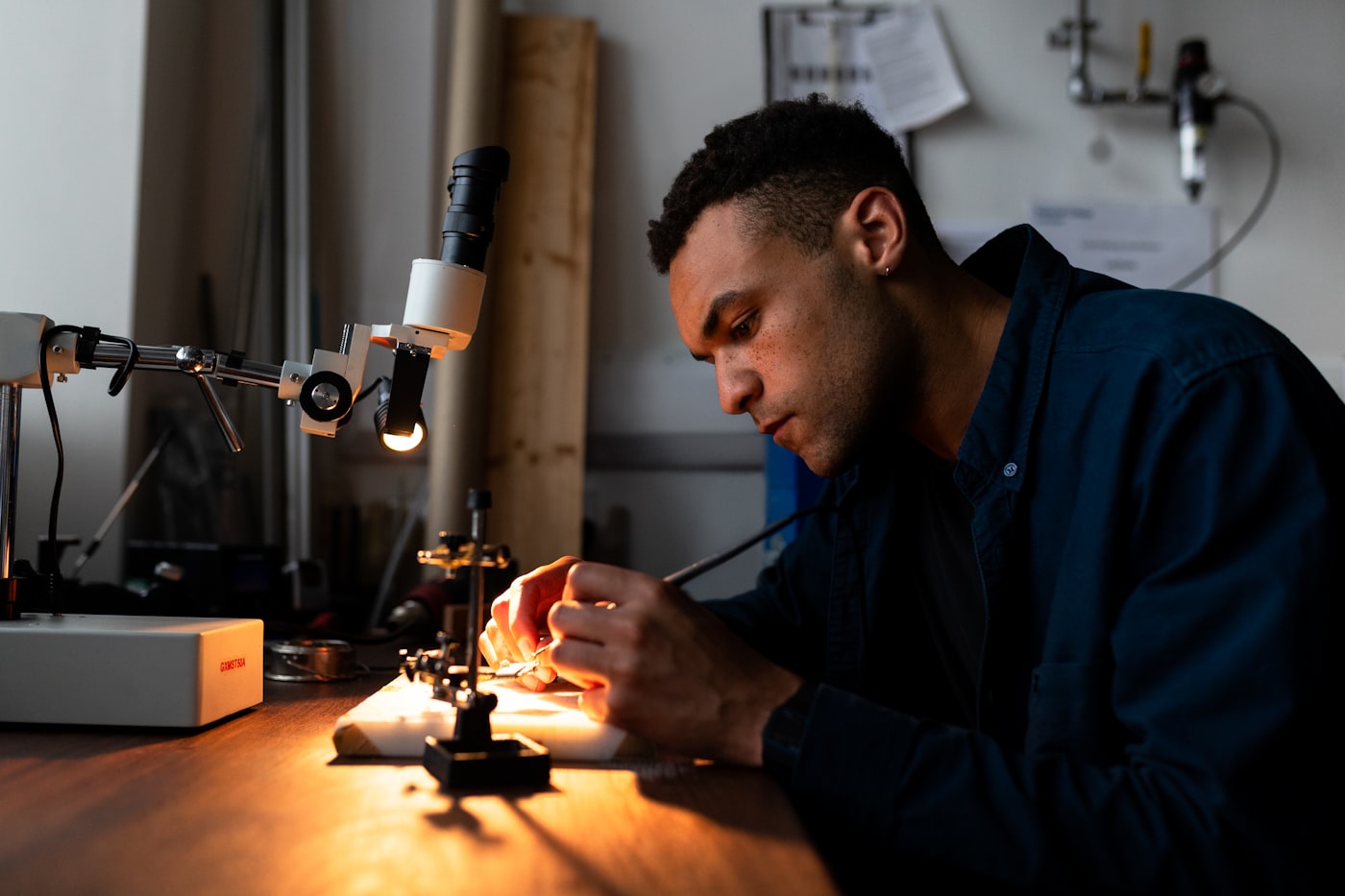 Technician at a precision engineering workbench