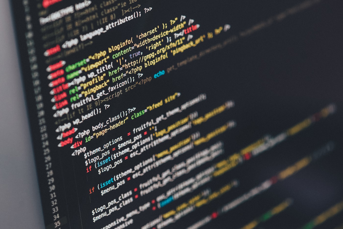 Close-up of software source code on a monitor