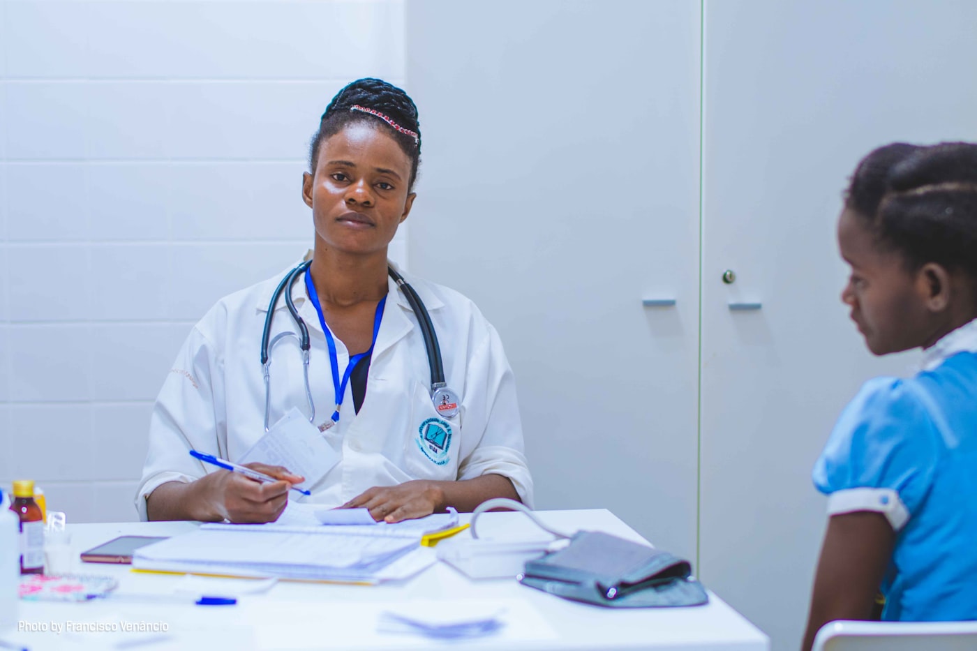 Doctor consulting with a young patient in a clinic
