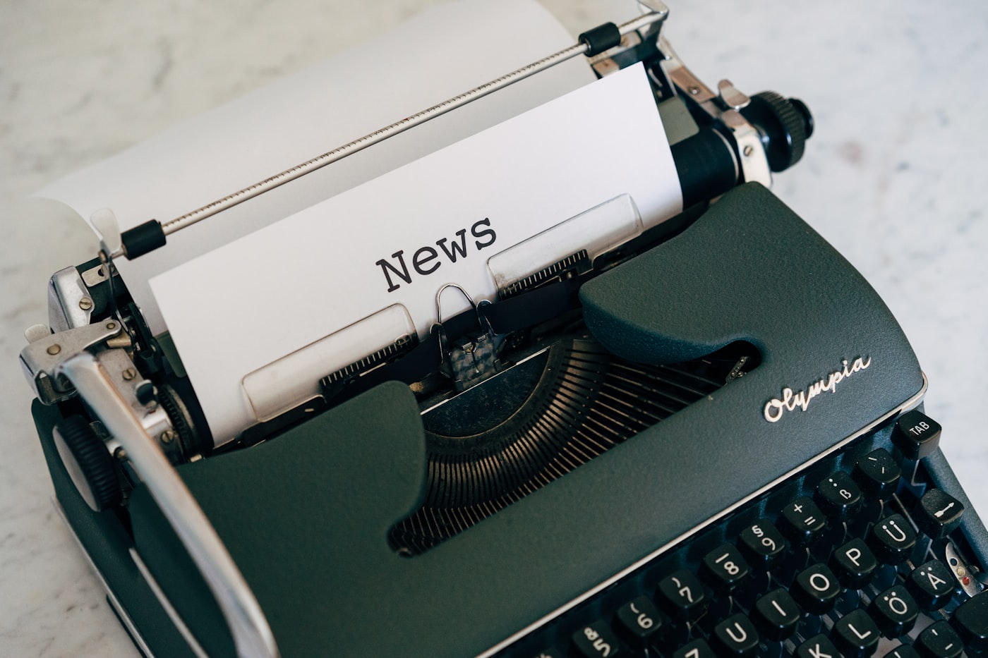 Vintage typewriter with a sheet reading News